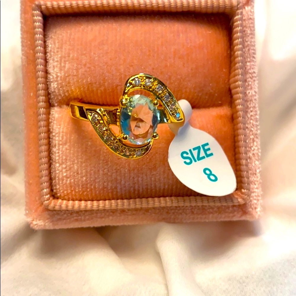 Ring is Aquamarine and QZ setting it is gold plated around but will not tarnish